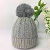 Cable knit pom-pom hat